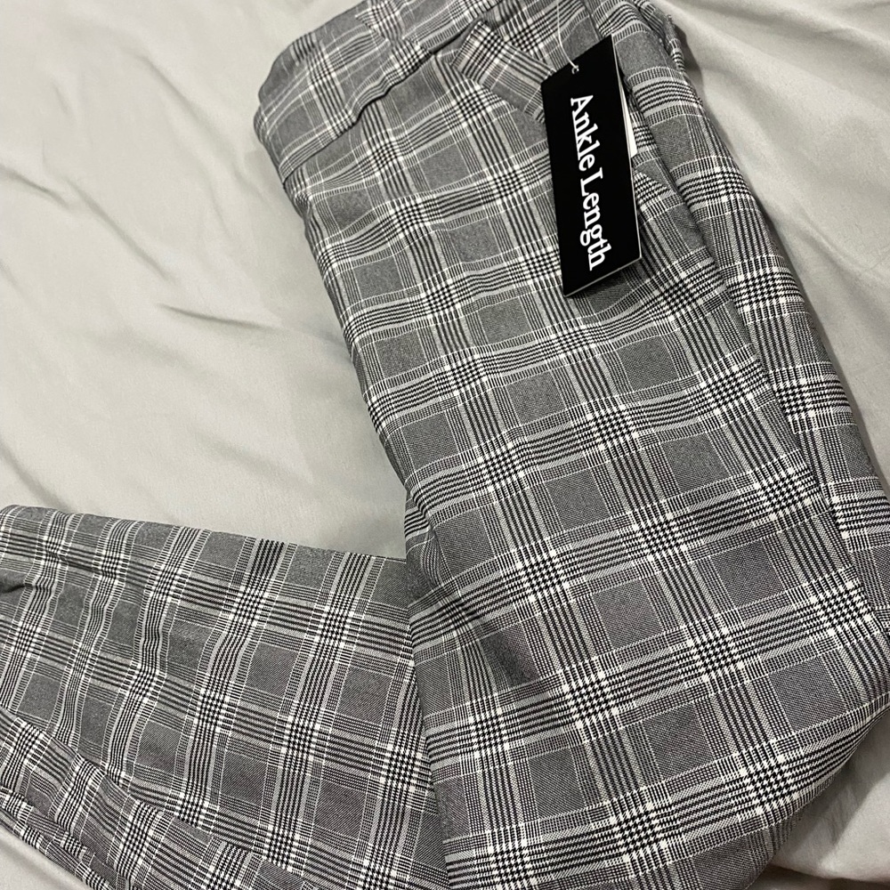 Plaid pants with tags never been worn. Size medium! Plaid pants!